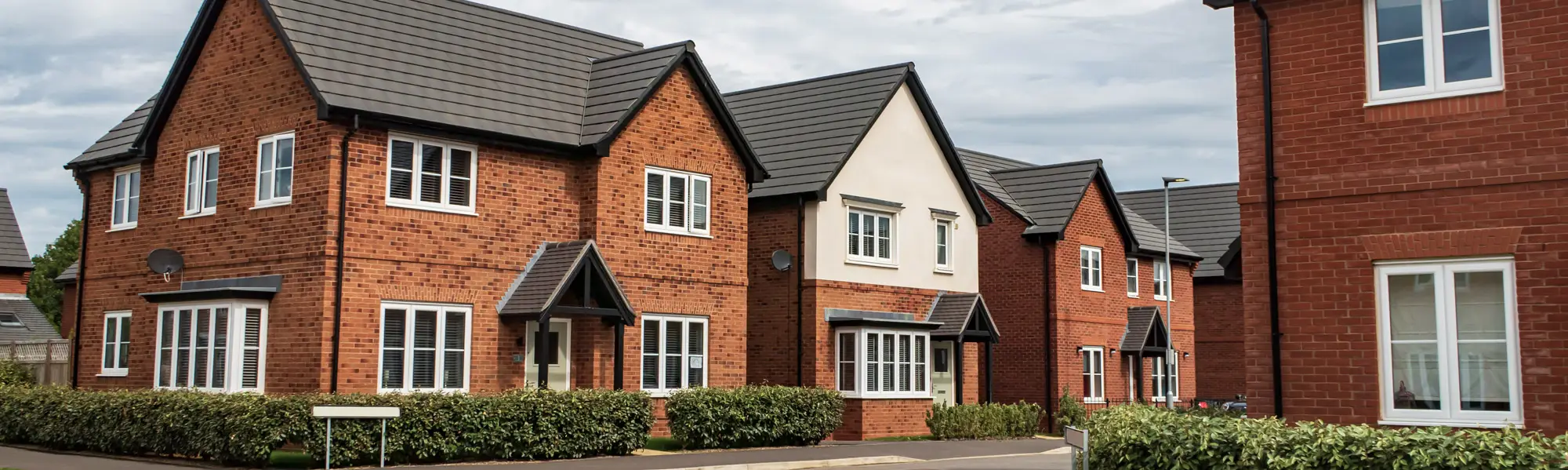 A row of modern brick built family homes