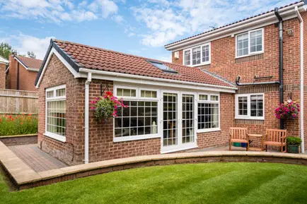 A single storey brick extension with garden doors